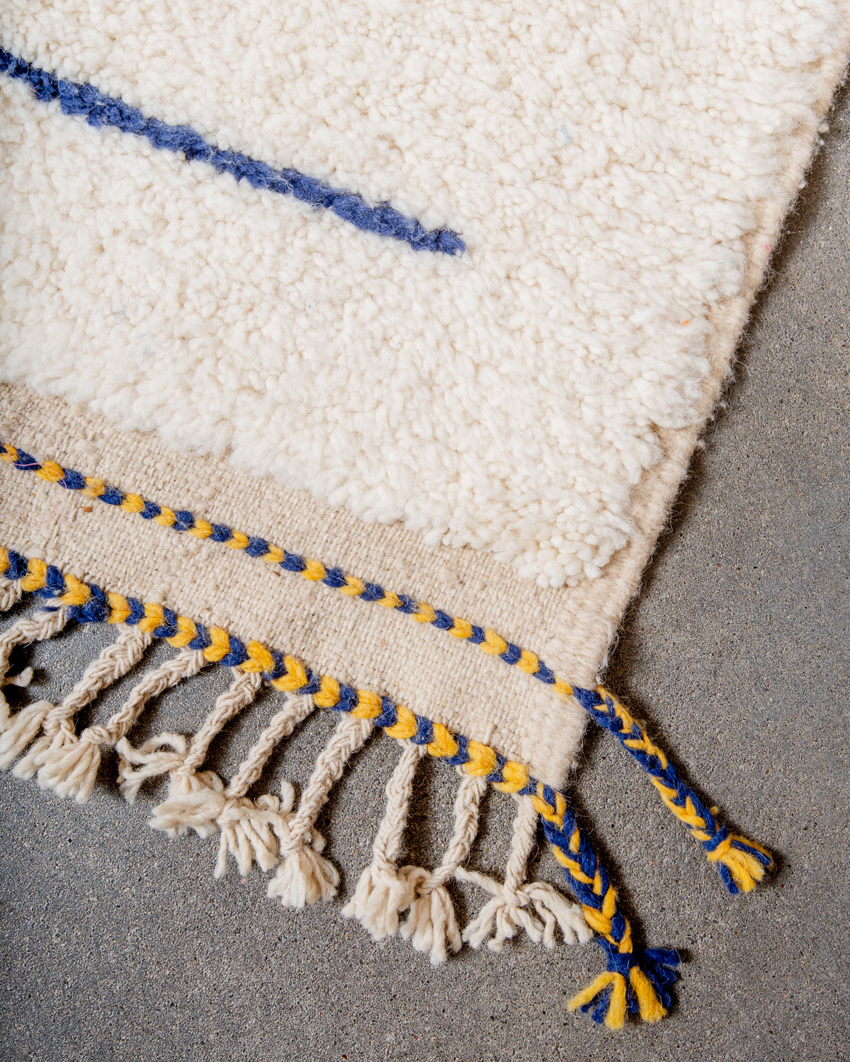 Modern, designer, handcrafted Berber rug from Morocco. Beniourain carpet with beautiful colours and patterns and fluffy wool texture.